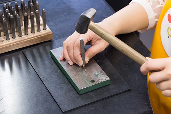 Engraving rings at the workshop