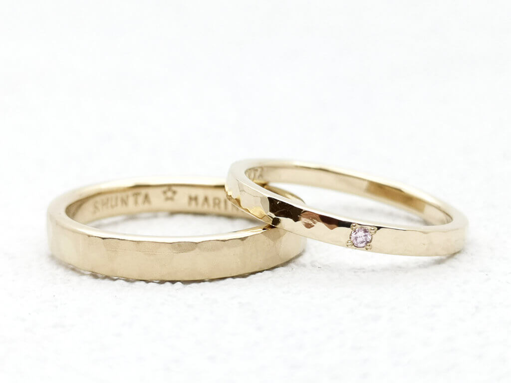 Hammered handmade wedding band with frosted champagne gold and pink diamonds