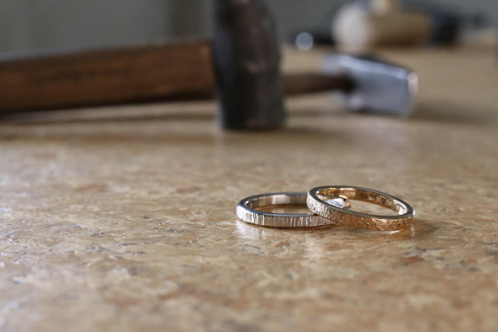 Handmade wedding rings ready to be sent on their way 💌 Details 💍 Ring 1:  2.6mm 18ct yellow gold band with 8x diamonds and 1x green… | Instagram