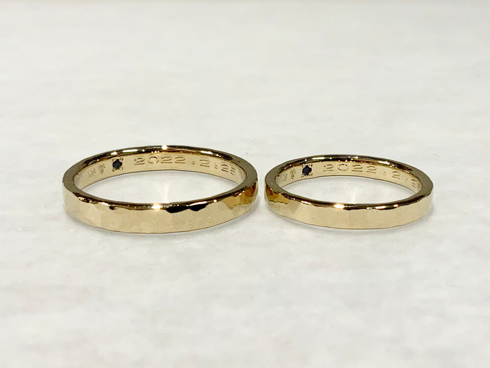 Hammered handmade wedding band in champagne gold