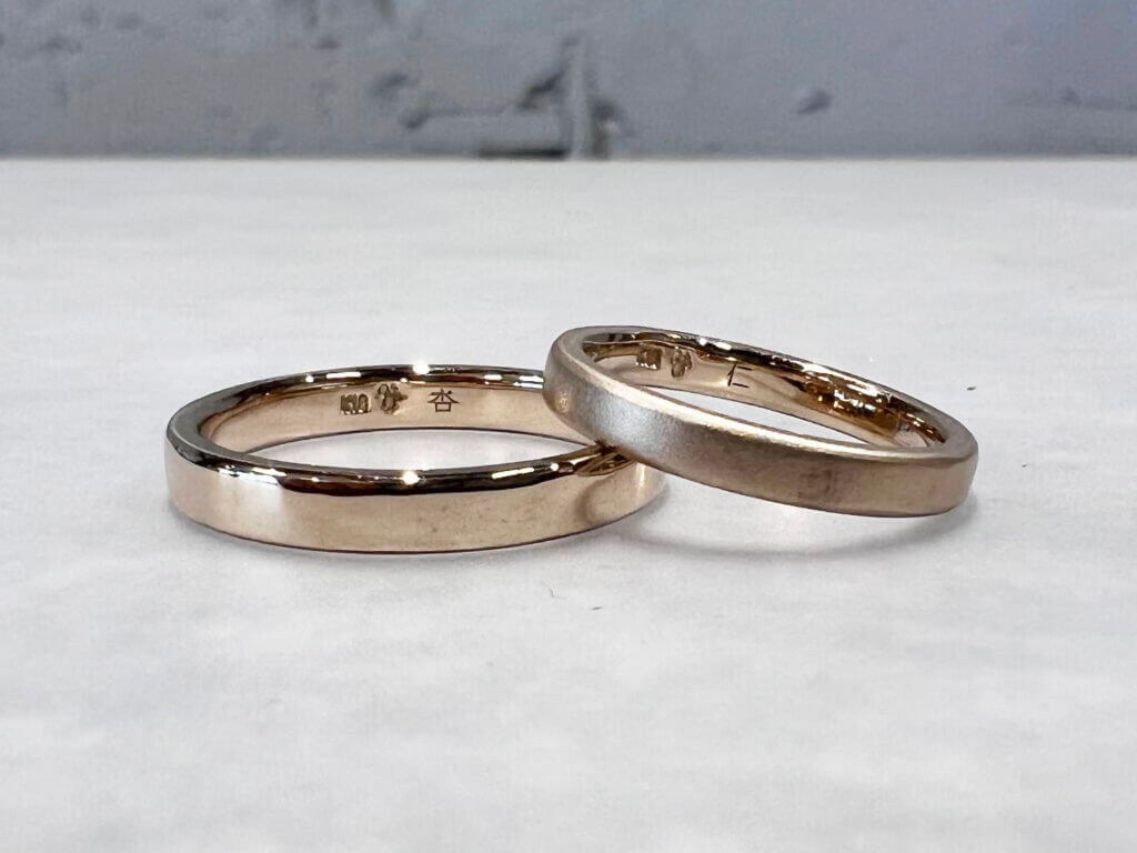 Champagne gold handmade wedding band with laser engraving of each other's names