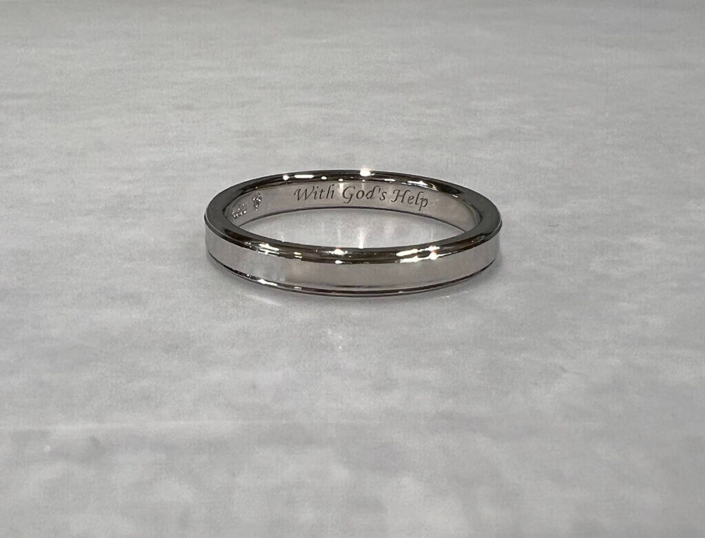 Platinum ring with lines on the side