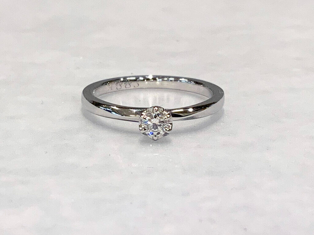 Twist-finish engagement ring